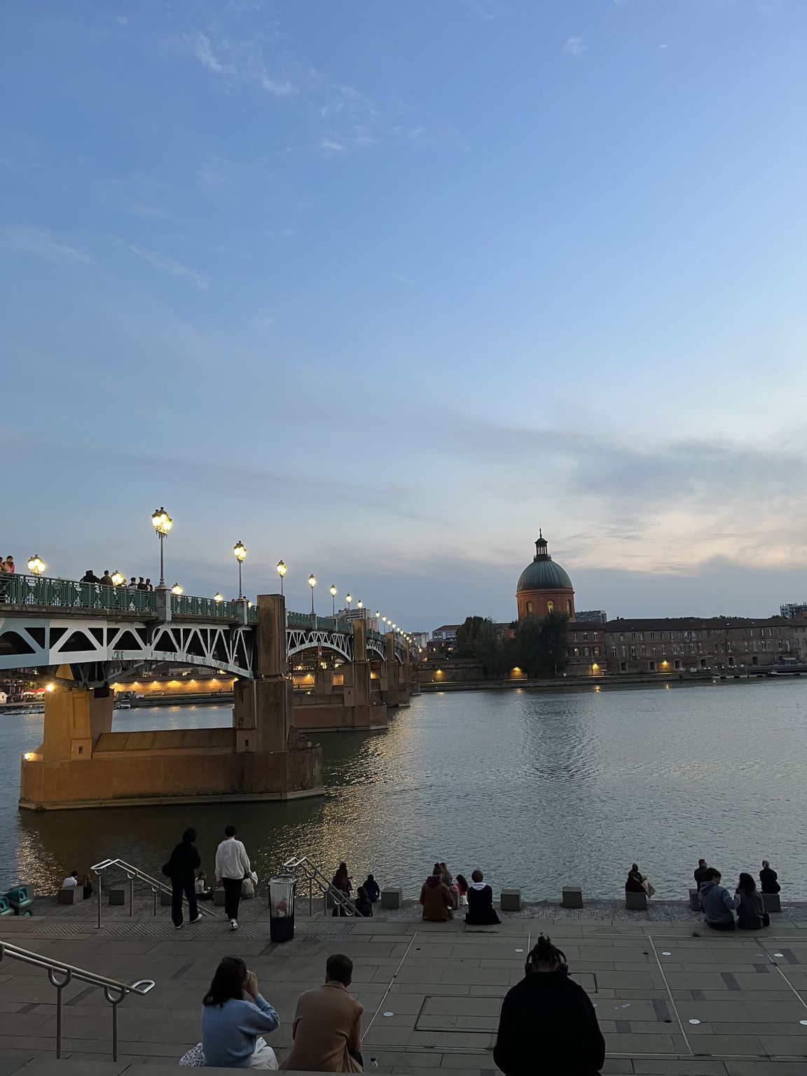 Stairs of Place Saint-Pierre and the Garonne river at sunset