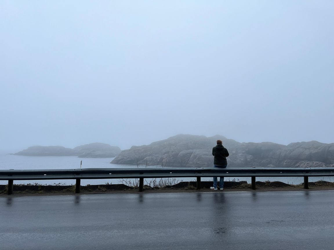 Mom taking pictures of islets in the foggy sea